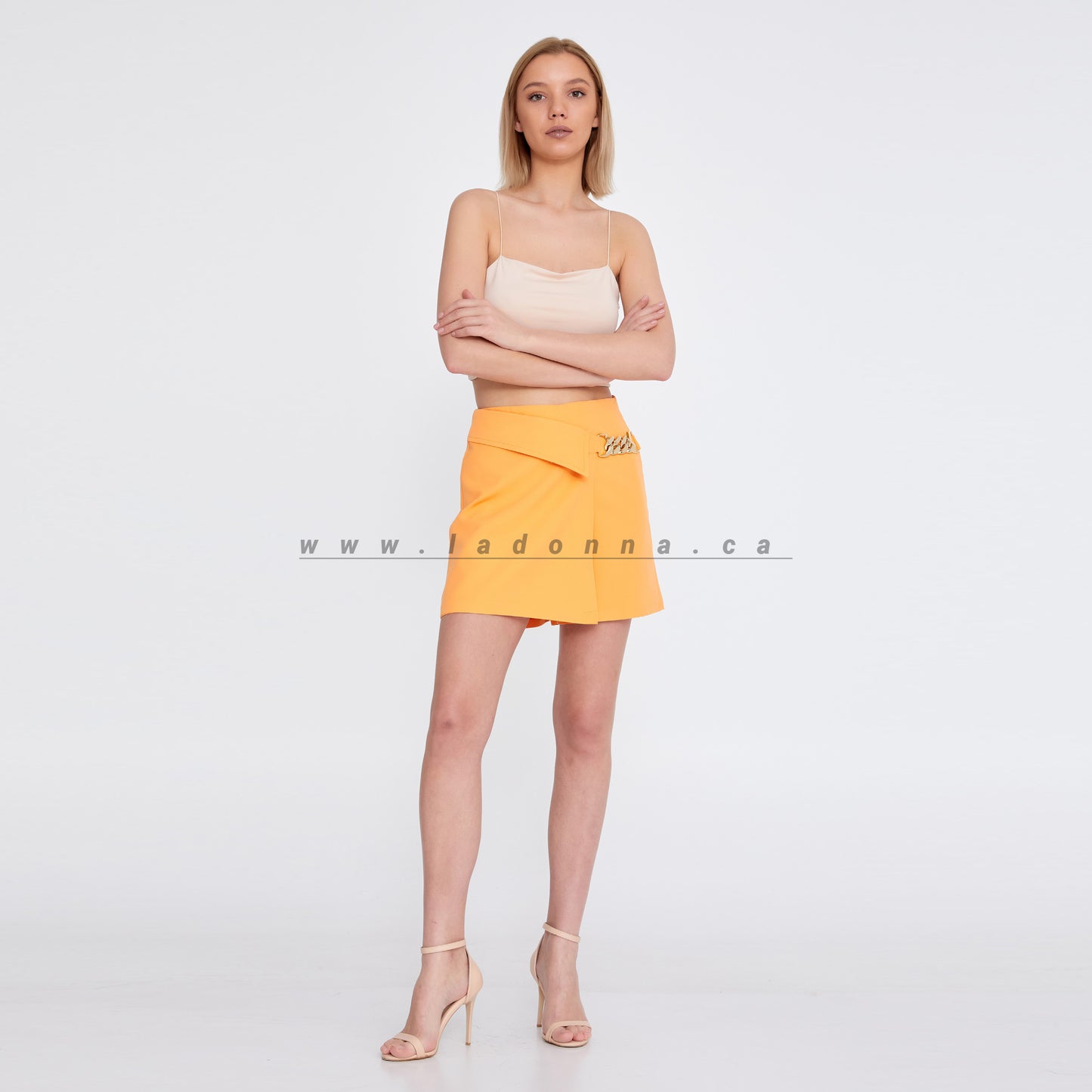 ORANGE MINI SKIRT FEATURED WITH A CHAIN ON THE SIDE